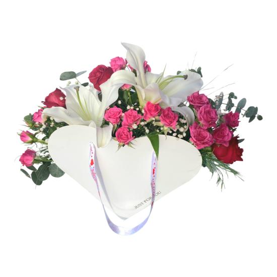 Red Roses, Lilies, Pink Arbor Roses in a Heart Flower Bag